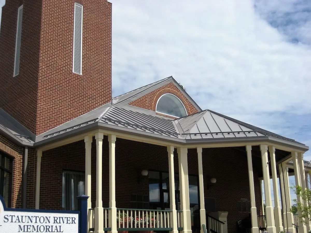 Skilled roofing craftsmen working on a residential roof in Jamestown